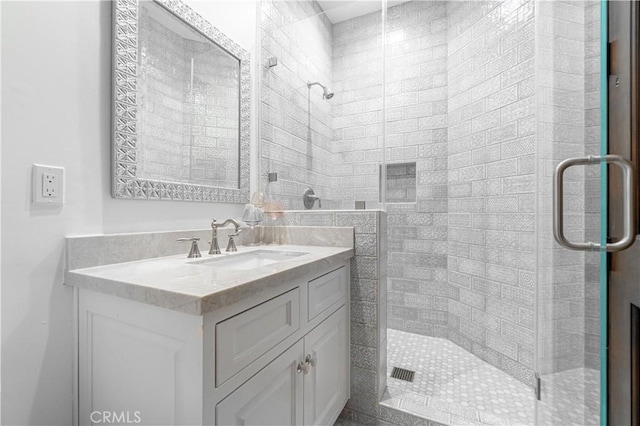 bathroom featuring vanity and walk in shower