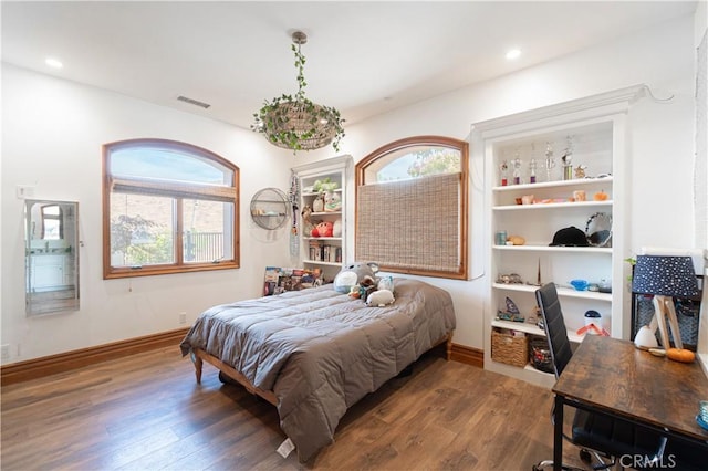 bedroom featuring visible vents, recessed lighting, baseboards, and wood finished floors