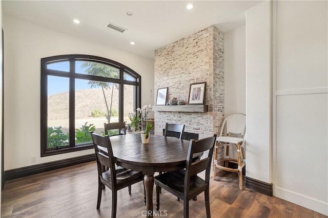 dining room with a mountain view and dark wood-type flooring