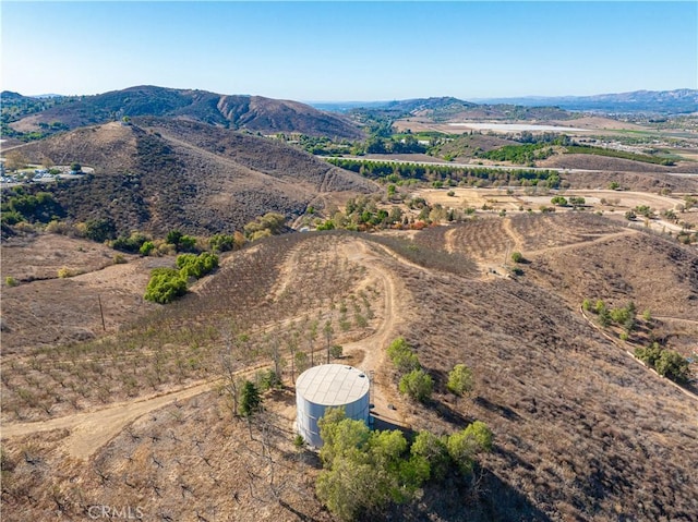 drone / aerial view featuring a rural view and a mountain view