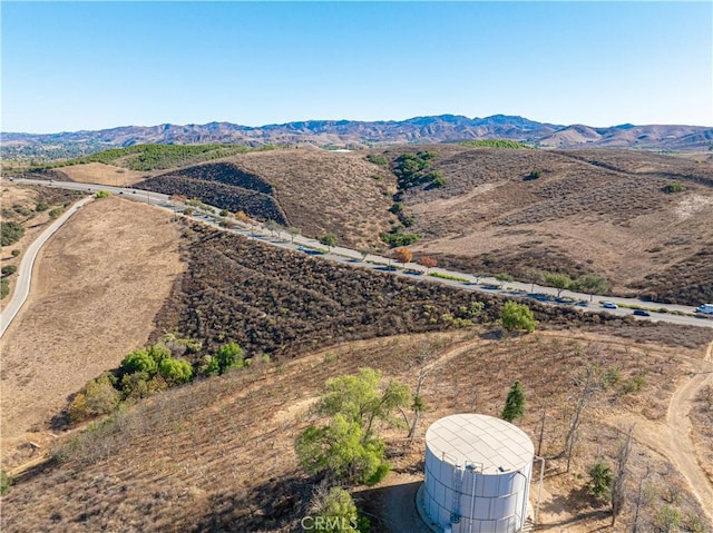 drone / aerial view featuring a mountain view and a rural view