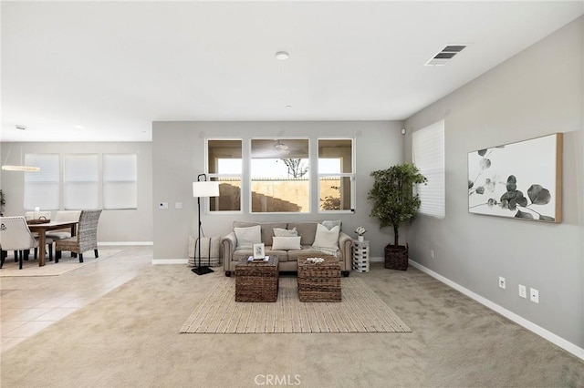 living area featuring light colored carpet