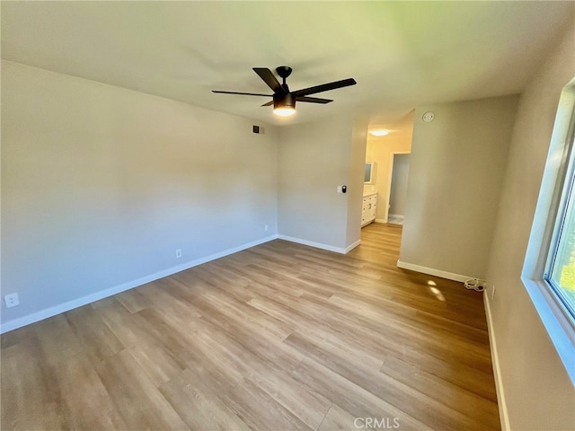 unfurnished room featuring light hardwood / wood-style flooring and ceiling fan