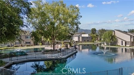 view of pool with a water view