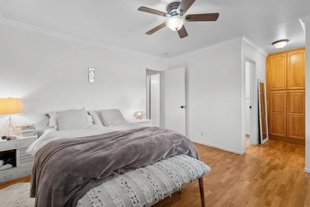 bedroom with crown molding, ceiling fan, and light wood-type flooring