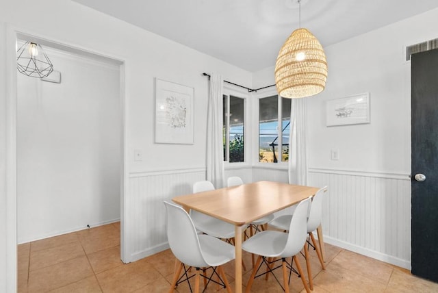 dining area featuring light tile patterned floors