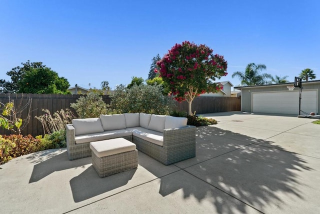 view of patio featuring a garage and outdoor lounge area