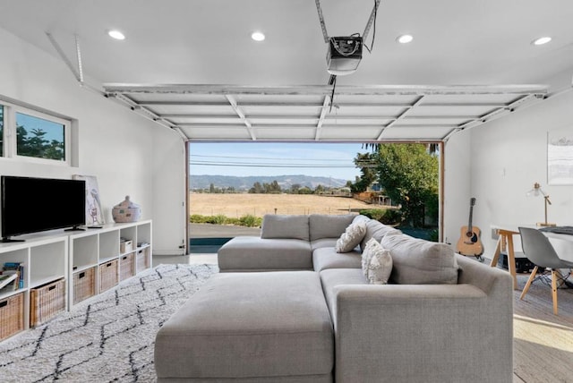 garage featuring a mountain view and a garage door opener