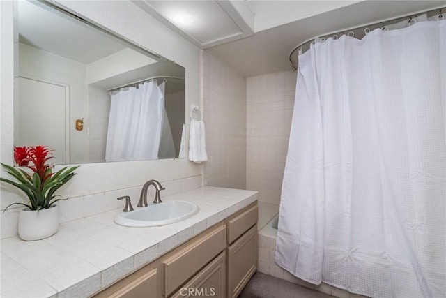 bathroom featuring vanity and shower / bath combo