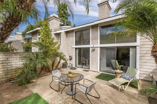 rear view of house with a patio