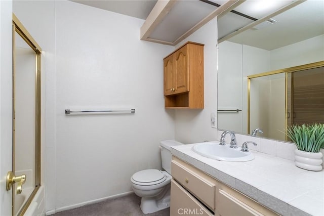 full bathroom featuring vanity, toilet, and bath / shower combo with glass door