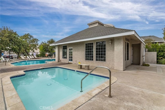 view of swimming pool with a patio