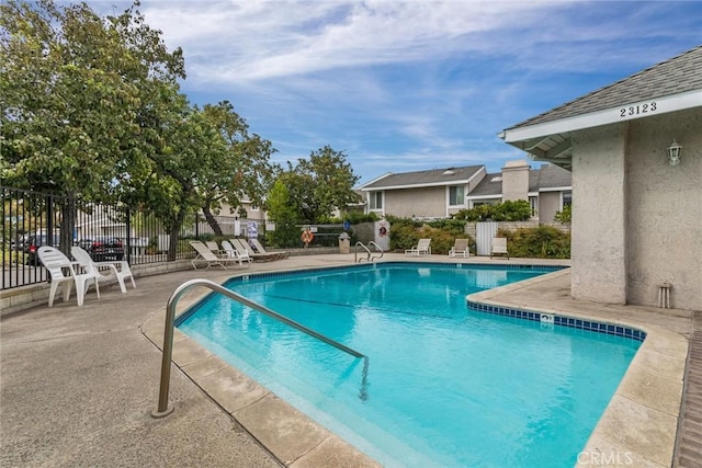 view of swimming pool featuring a patio area