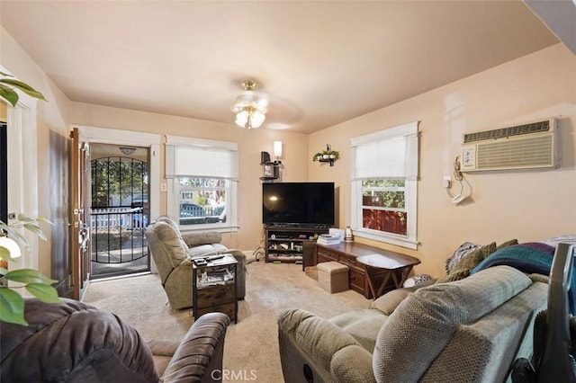 carpeted living room with a wall mounted AC and ceiling fan