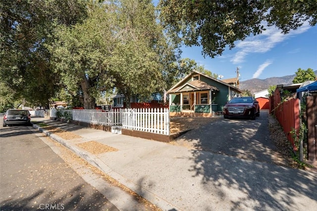 bungalow-style home featuring a mountain view and a porch