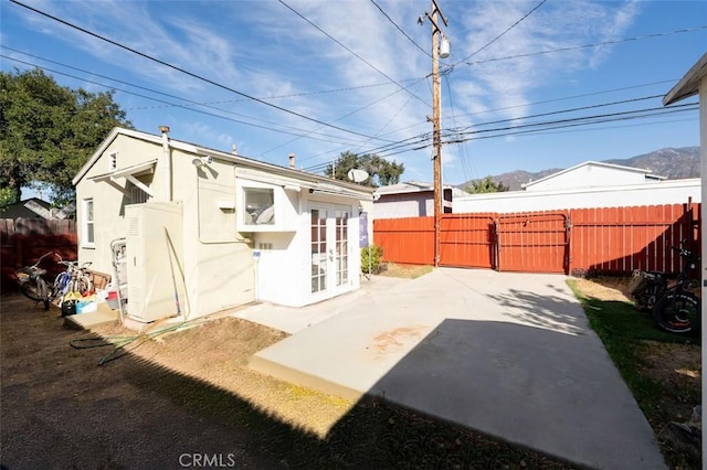 back of house featuring french doors and a patio area