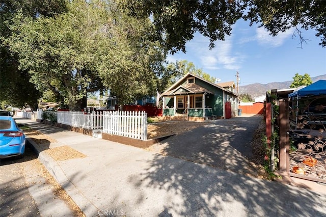 bungalow featuring a mountain view and covered porch