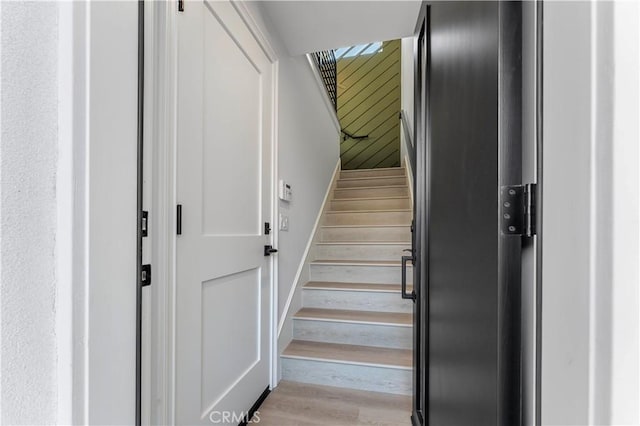 staircase featuring wood-type flooring