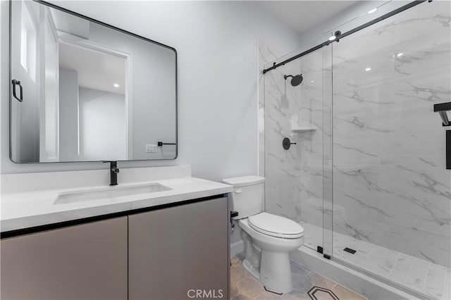 bathroom with toilet, vanity, tile patterned floors, and an enclosed shower