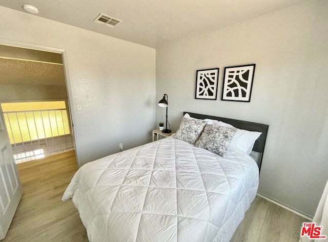 bedroom featuring light hardwood / wood-style flooring