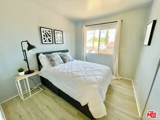 bedroom with light hardwood / wood-style flooring