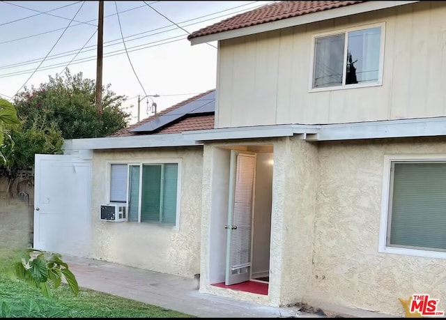 view of property exterior featuring a patio area