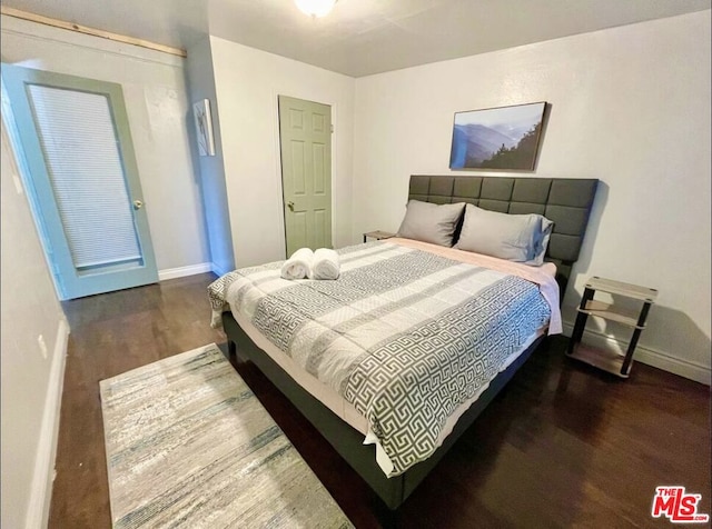 bedroom featuring dark hardwood / wood-style floors