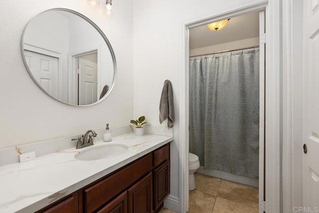 bathroom featuring vanity, toilet, tile patterned floors, and curtained shower