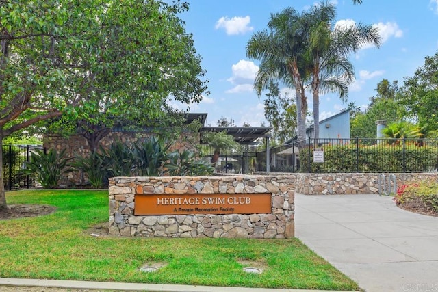 community sign featuring a lawn