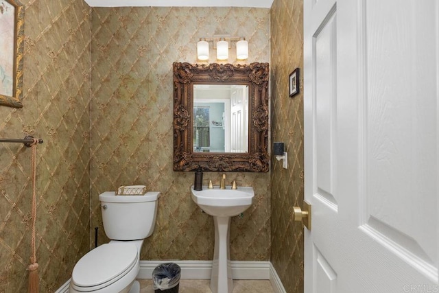 bathroom with tile patterned floors and toilet