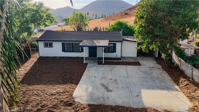 ranch-style home with a mountain view