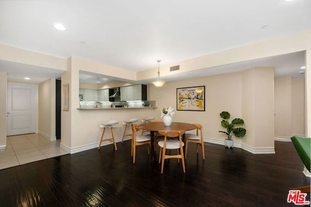 dining space featuring hardwood / wood-style floors