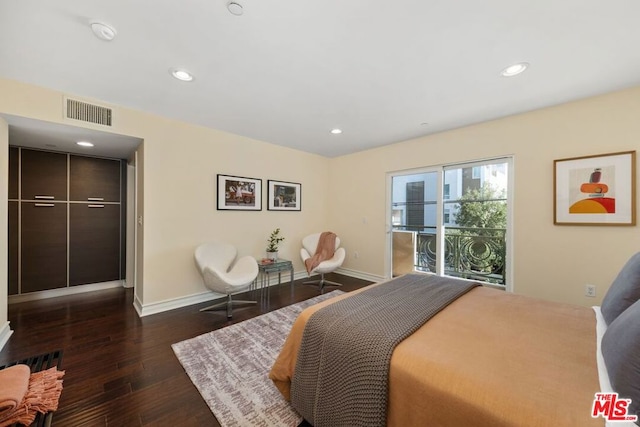 bedroom featuring access to outside and dark hardwood / wood-style floors