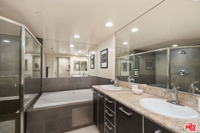 bathroom featuring plus walk in shower and vanity