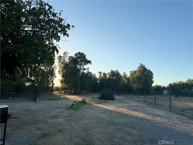 view of yard with a rural view