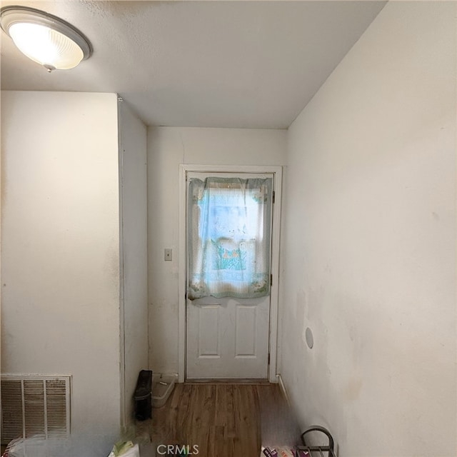 doorway to outside with hardwood / wood-style floors