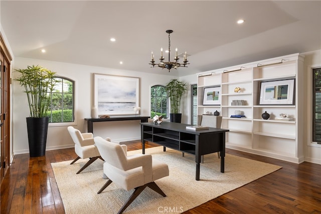 office featuring dark wood-type flooring and an inviting chandelier