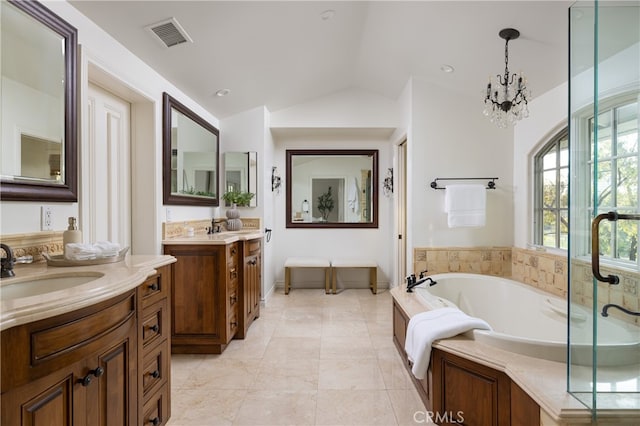 bathroom with vanity, lofted ceiling, shower with separate bathtub, and a notable chandelier