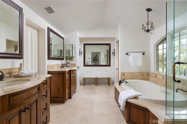 3 Cypress Point Ln, Newport Beach, CA 92660 - full bathroom with a bath, two vanities, vaulted ceiling, and a chandelier