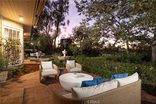 patio terrace at dusk with an outdoor hangout area