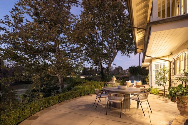 view of patio terrace at dusk