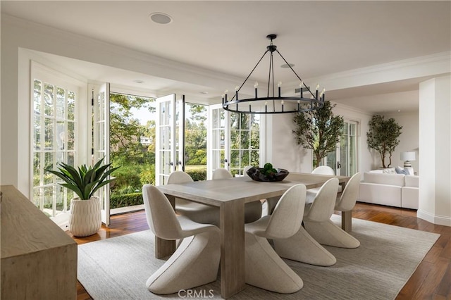 3 Cypress Point Ln, Newport Beach, CA 92660 - dining space with ornamental molding, a chandelier, healthy amount of natural light, and dark wood-style flooring