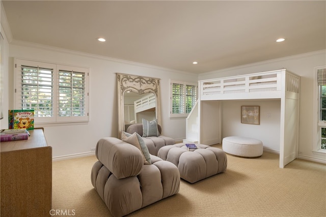 bedroom with ornamental molding and light colored carpet