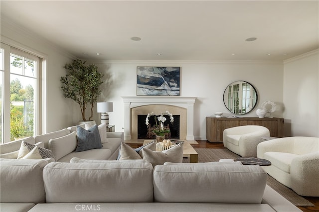 living room with crown molding and hardwood / wood-style flooring