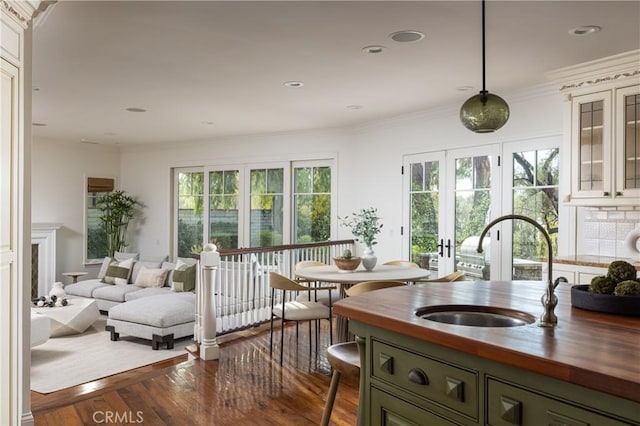3 Cypress Point Ln, Newport Beach, CA 92660 - kitchen featuring wooden counters, healthy amount of natural light, dark wood finished floors, green cabinets, and ornamental molding