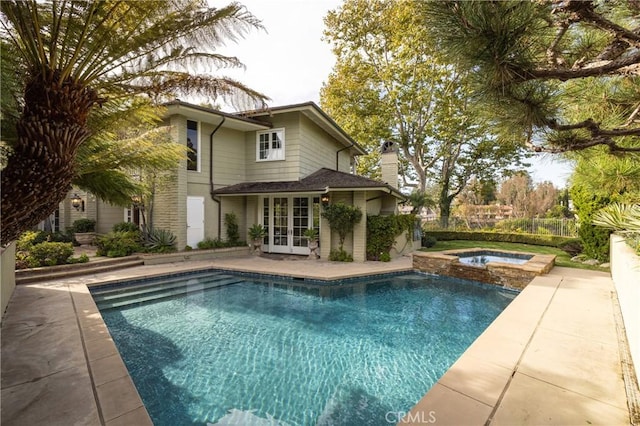 3 Cypress Point Ln, Newport Beach, CA 92660 - view of swimming pool featuring french doors, a patio, and a pool with connected hot tub