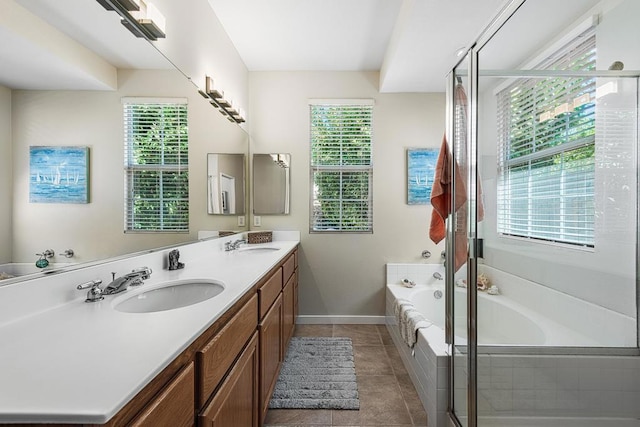 bathroom with tile patterned flooring, vanity, plenty of natural light, and independent shower and bath