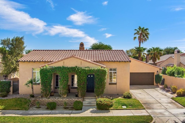 mediterranean / spanish-style house with a porch and a garage