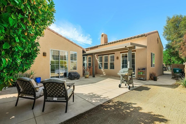 back of house featuring a patio