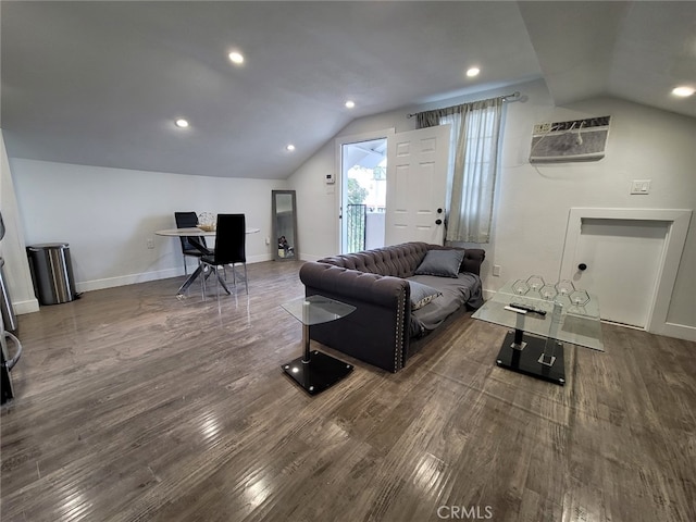 living room featuring a wall unit AC, lofted ceiling, and dark hardwood / wood-style flooring